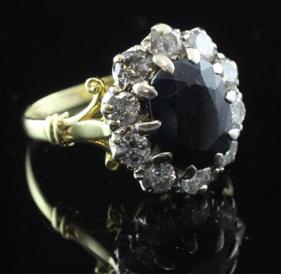 1970s 18ct gold, sapphire and diamond cluster ring, size P.(-)